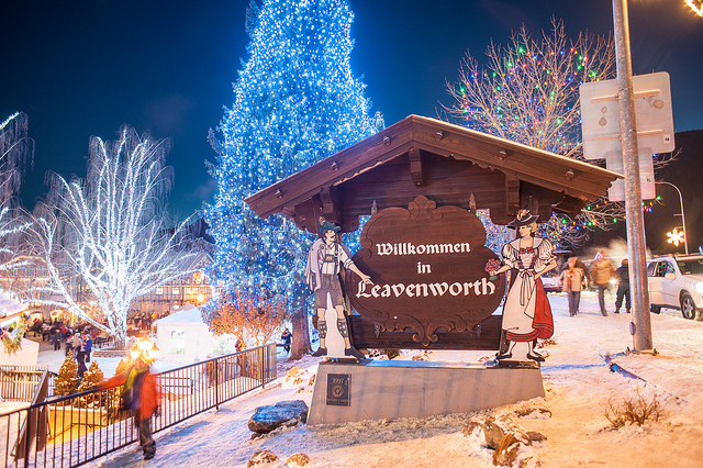 welcome to leavenworth sign with christmas lights in background