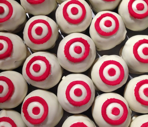 white cake balls with red target bullseye logo on top